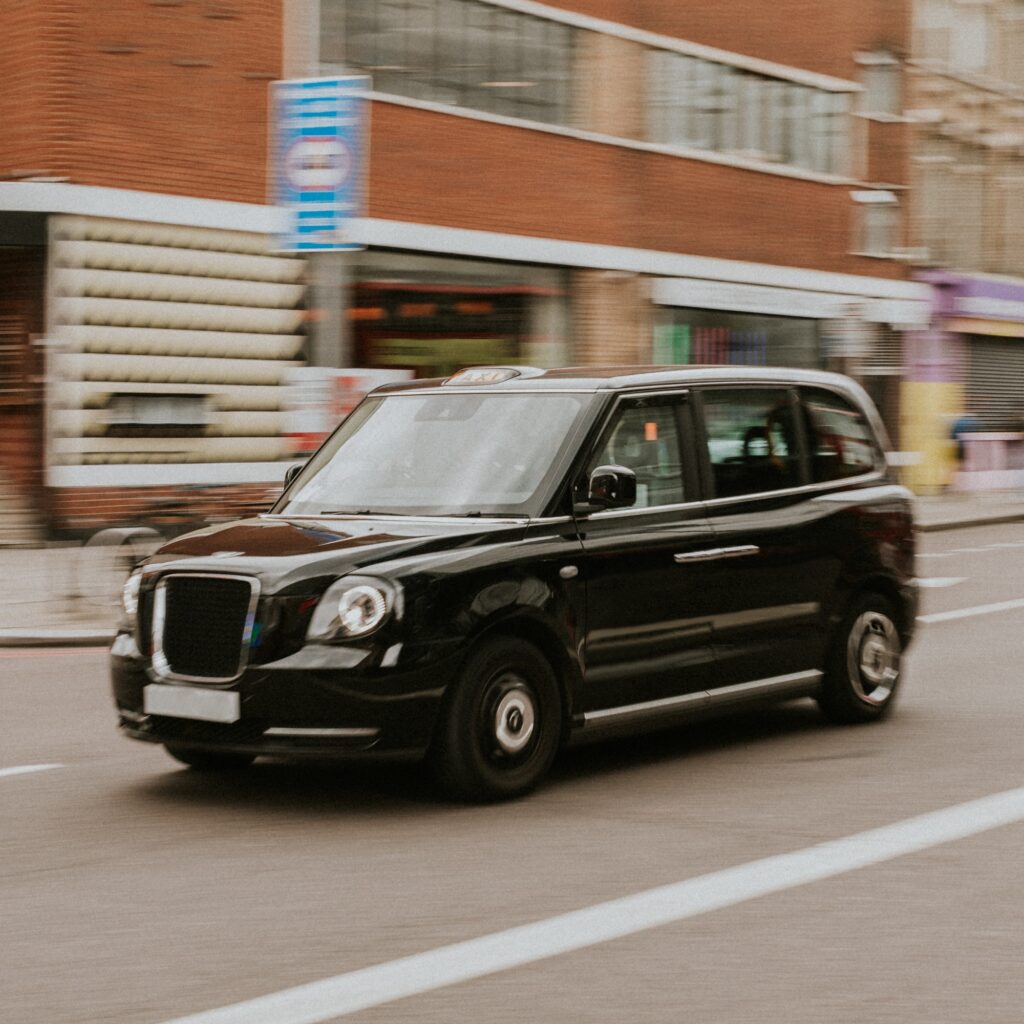 Vintage car travelling through London street
